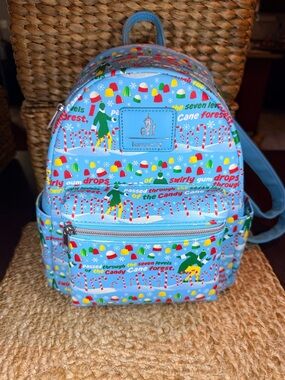 Loungefly “Elf-I Passed Through The 7 Levels Of The Candy Cane Forest” Backpack